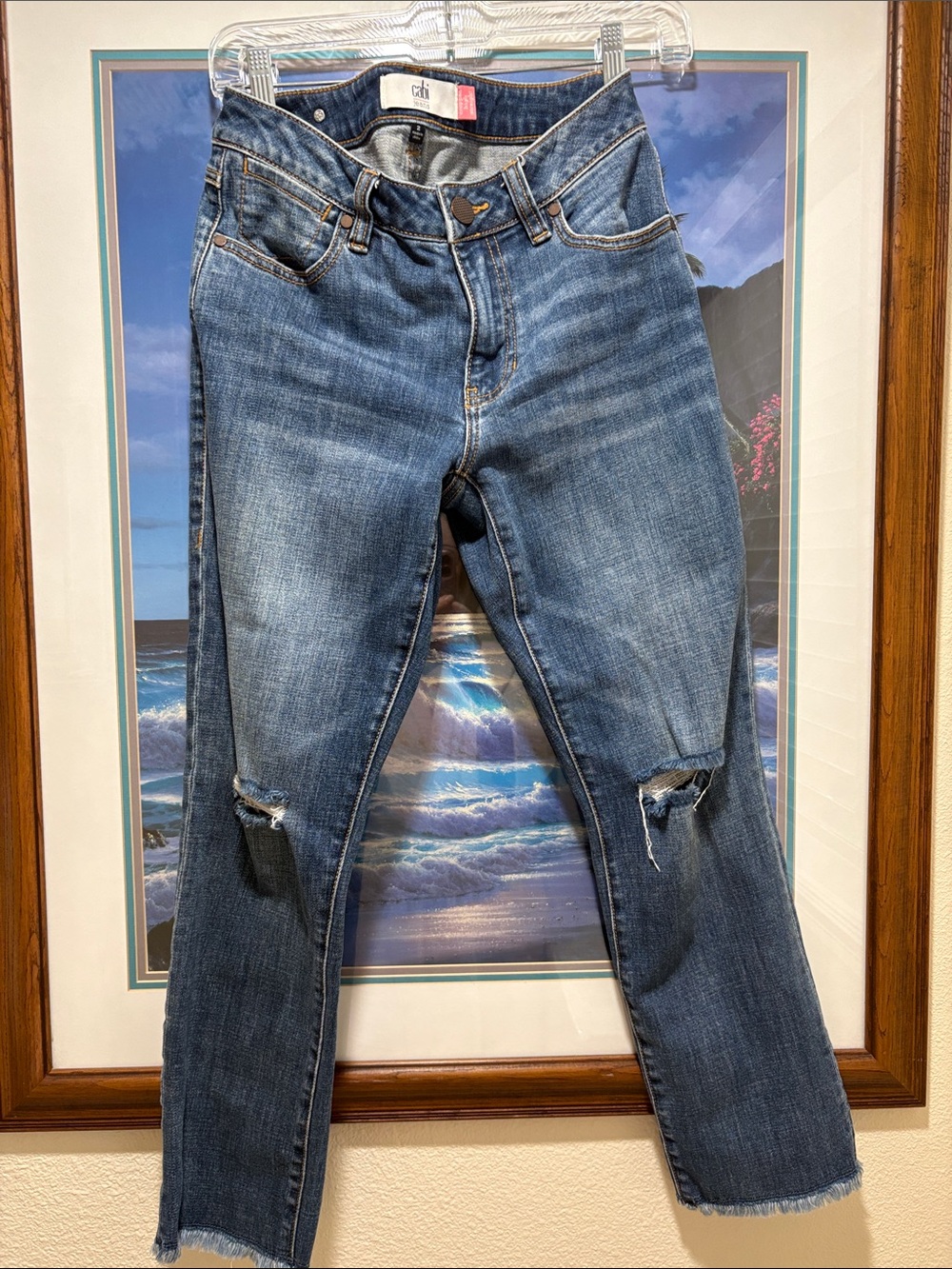 CAbi Women's Skinny Jeans in Mid Blue with Knee Rips